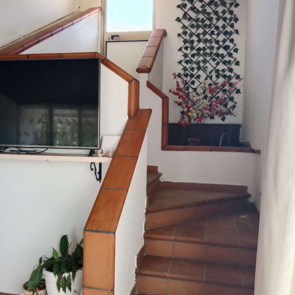 Treppe zum Hinterausgang
